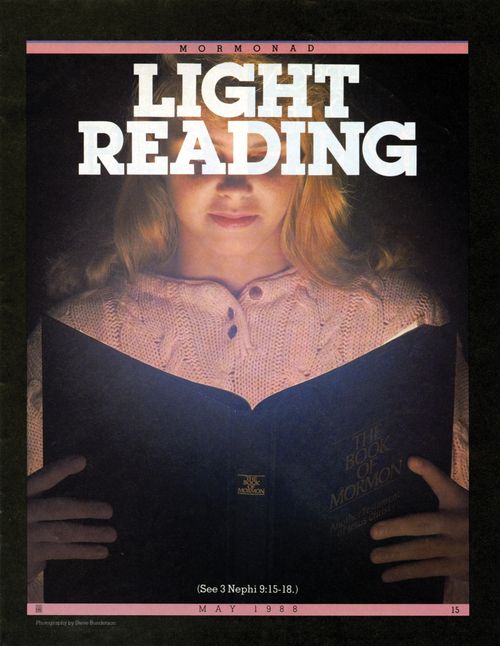 A poster of a young woman sitting in a dark room and reading from a copy of the Book of Mormon that is glowing, paired with the words “Light Reading.”