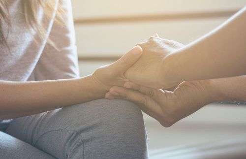 close-up of people holding hands