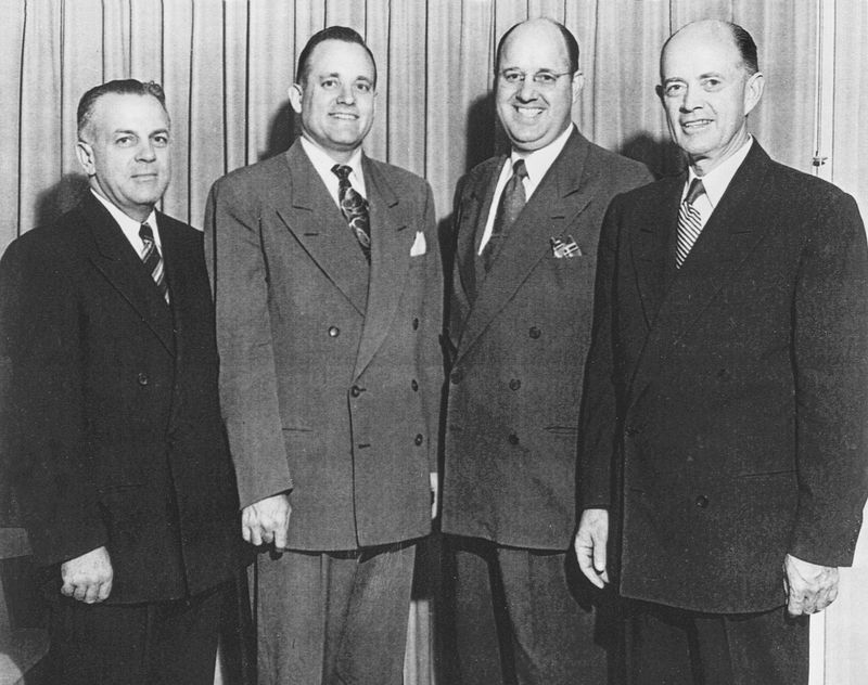 President Howard W. Hunter standing with three other men in the Pasadena California Stake in 1950.