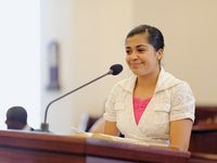 young woman speaking at pulpit