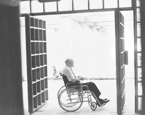 President Howard W. Hunter seated in a wheelchair in a doorway of the BYU Jerusalem Center.