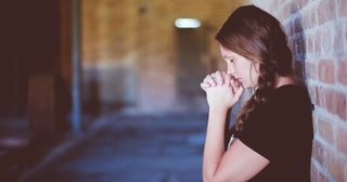 young adult praying