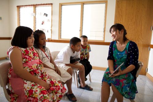 woman and children in class