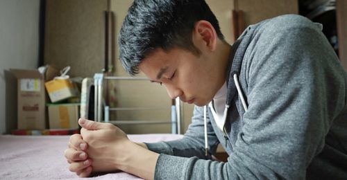 young man praying