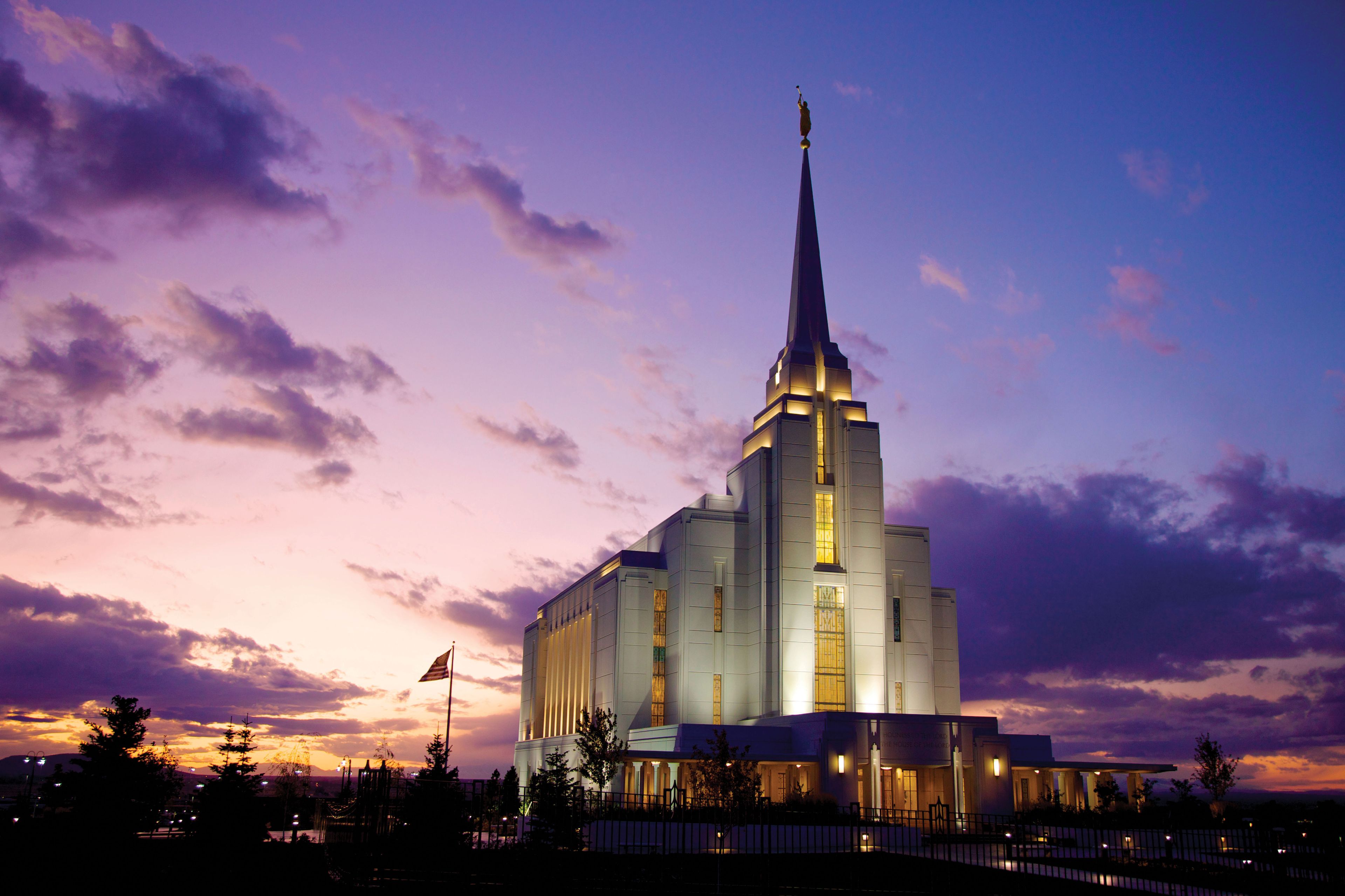The Rexburg Idaho Temple in the evening, including scenery and clouds.