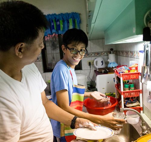 two people washing dishes