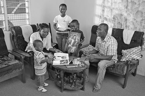 Family studying gospel