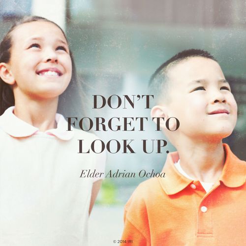 A photograph of two children, paired with a quote by Elder Adrián Ochoa: “Don't forget to look up.”