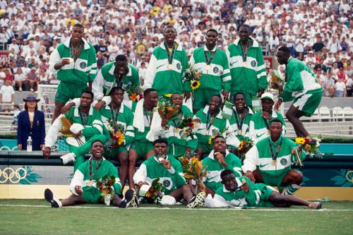 Nigerian football team with gold medals.