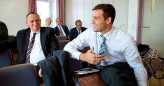 men have a discussion in an elders quorum meeting