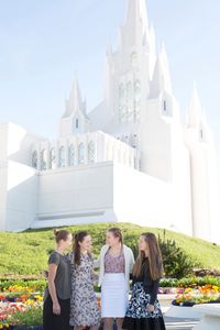 group of youth in front of temple