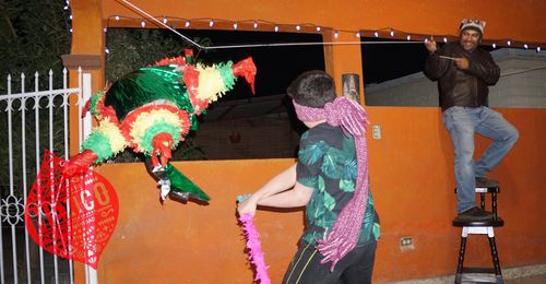 child hitting pinata