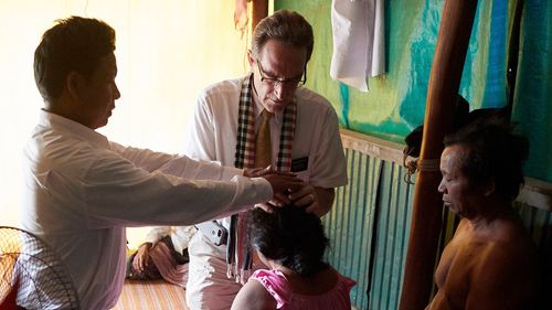 woman receiving a priesthood blessing