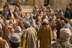 Mary and Joseph find young Jesus teaching professors and theologians at the temple about the gospel