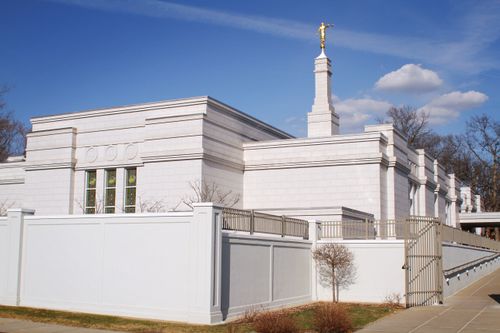 The back of the St. Paul Minnesota Temple, including a view of windows, the spire, and the angel Moroni on top.