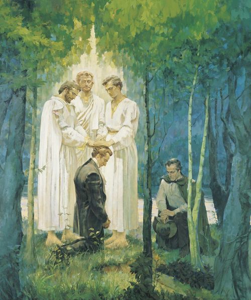 The Prophet Joseph Smith, Jr. kneeling on the  banks of the Susquehanna River in may or June of 1829.  The New Testament-era Apostles Peter, James and John (dressed in white) are standing by Joseph.  The apostles have their hands upon Joseph's head as they confer the Melchizedek Priesthood upon him.  Oliver Cowdery is kneeling by Joseph.  There are trees in the foreground and background.