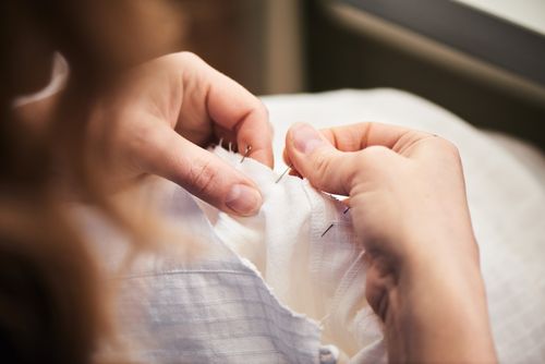 woman pinning fabric