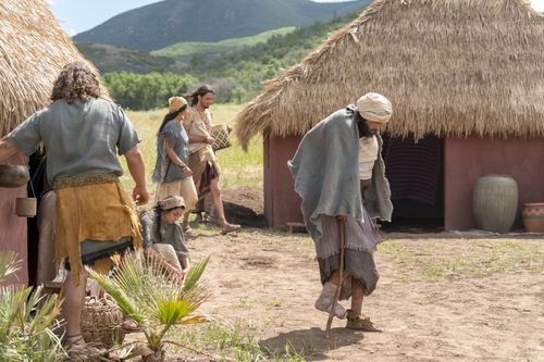 A disabled man walks toward the temple where the Nephites are gathered to hear Jacob teach.