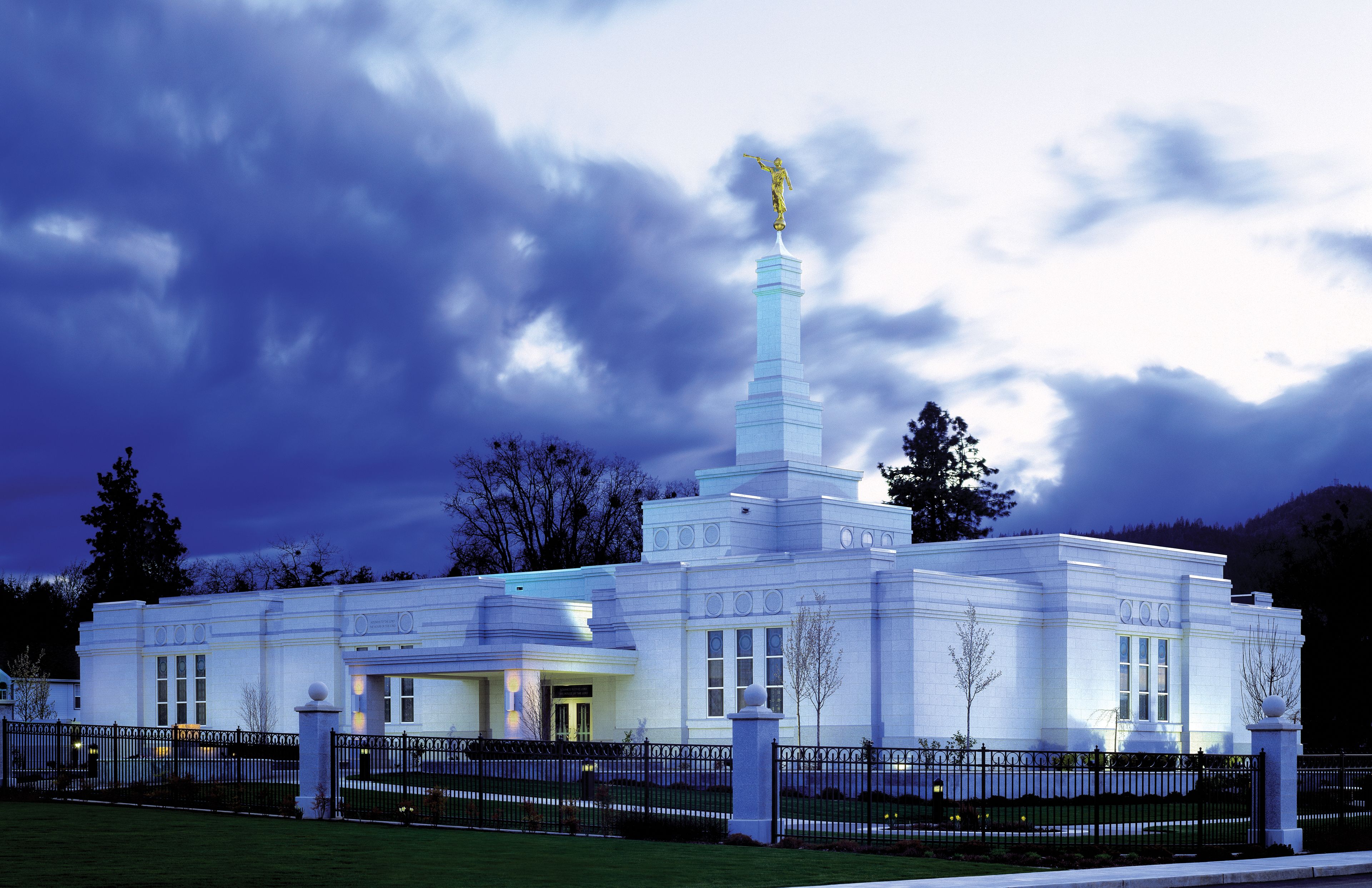 The Medford Oregon Temple in the evening, including the entrance and scenery.