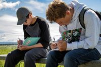 teenagers writing in journals