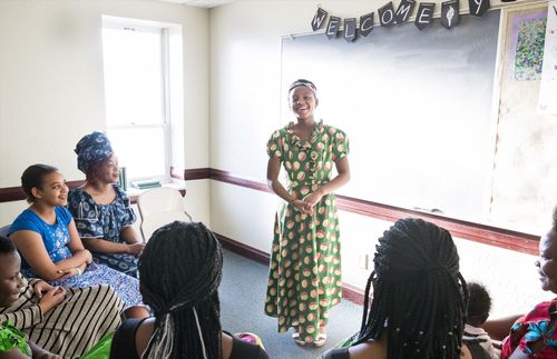 young woman standing in class