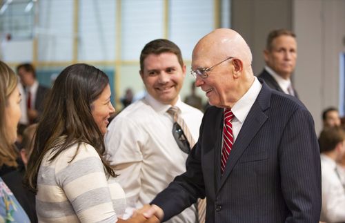 President Oaks greeting young adults