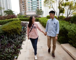 young couple holding hands