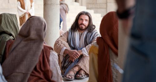 Christ is sitting down on the ground in the temple teaching a group of people. Outtakes included some more of Jesus teaching, the other outtakes with this image are from a different title: “Jesus Christ. Light of the World” showing Christ after the event of the Woman taken in Adultery and the Jews questioning his authority.