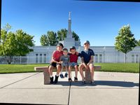 children sitting in front of temple