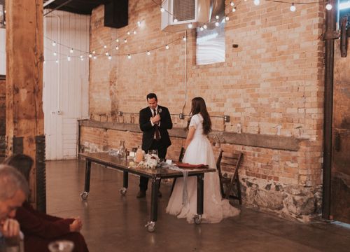 a new husband signs to his wife on their wedding day