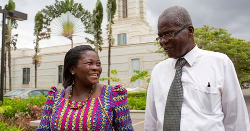 a man and a woman outside the Accra Ghana Temple