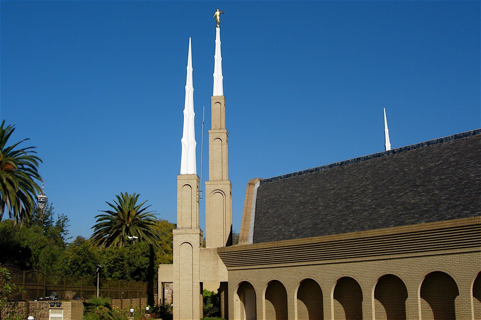The Johannesburg South Africa Temple spires, including a side view of the temple and scenery.