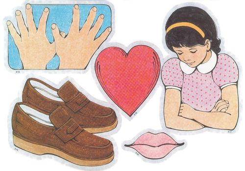 Primary cutouts of a child’s hands, a pair of brown shoes, a red heart, pink lips, and a black-haired girl with her arms folded in prayer.