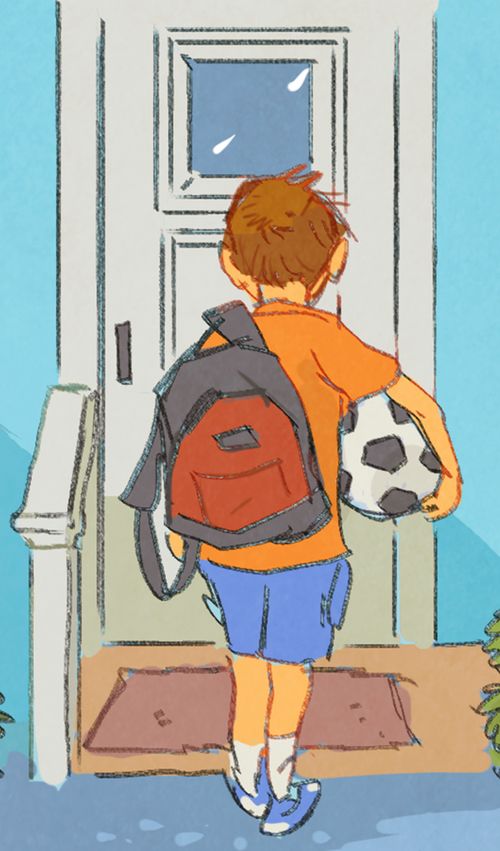Matt carrying soccer ball and walking outside
