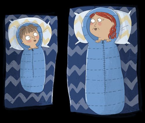 Boy and grandmother lying in sleeping bags