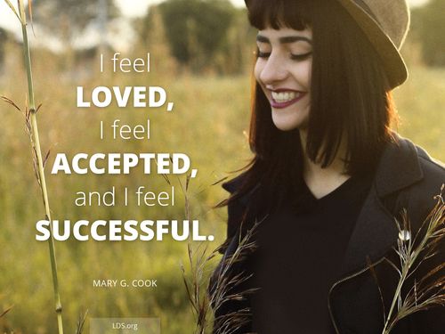 An image of a young woman smiling with the words “I feel loved, I feel accepted, and I feel successful.”