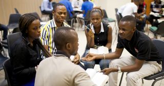 young adults talking in a circle