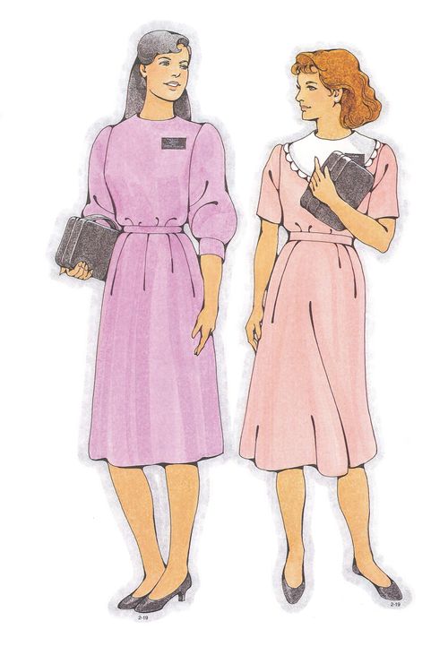 Two Primary cutouts of a black-haired sister missionary in a light purple dress and a brown-haired sister missionary in a light pink dress.