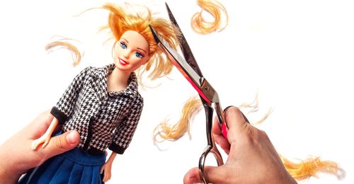 cutting a dolls’s hair