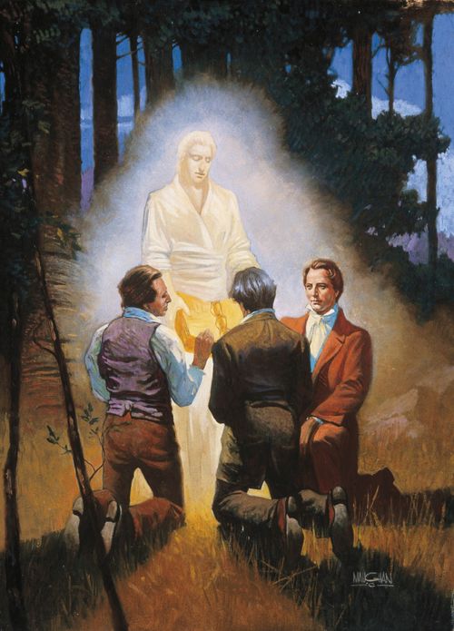 A painting by William L. Maughan showing Joseph Smith and two of the Three Witnesses kneeling in the forest while an angel stands before them holding the gold plates.