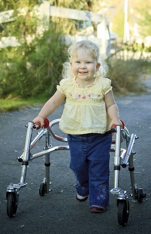 little girl using walker