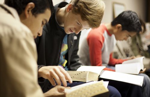 students reading scriptures