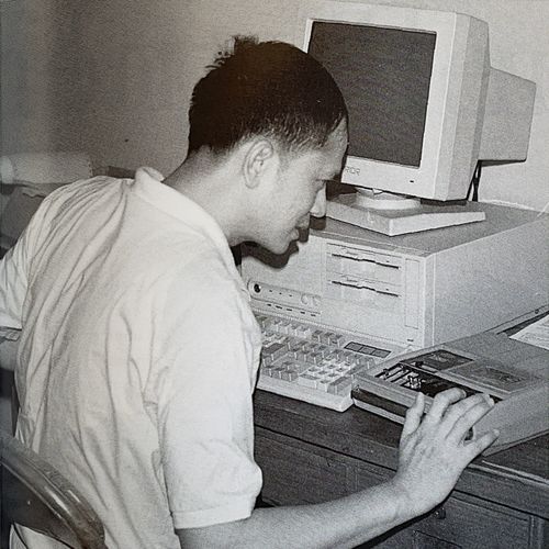 man sitting at computer
