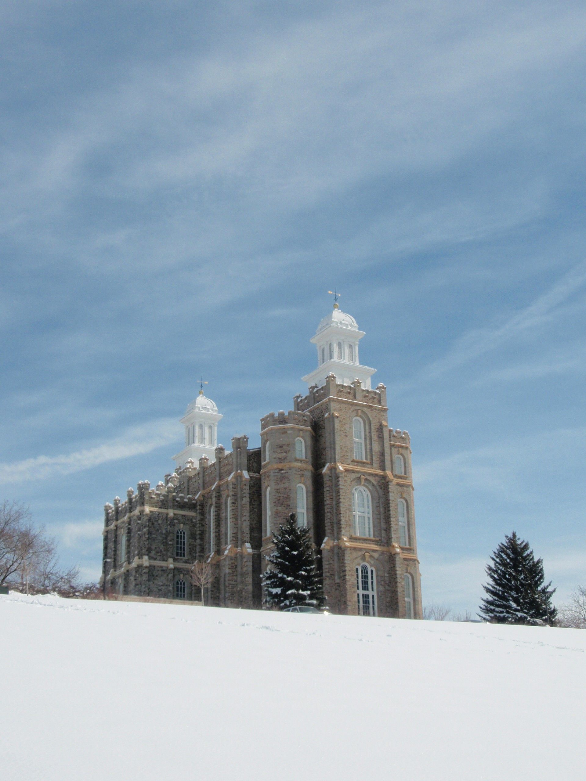 The Logan Utah Temple in the winter, including scenery.