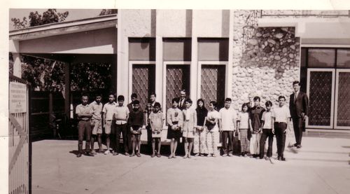group of people outside church meetinghouse