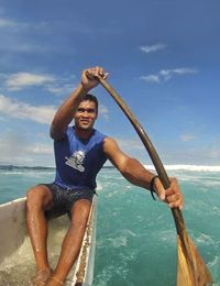 Gerry Huuti of Tahiti paddling a canoe.