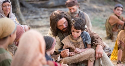 Jesus com um menino no colo