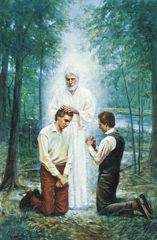 Joseph Smith, Jr. and Oliver Cowdery kneeling before John the Baptist. John the Baptist has his hands placed on the head of Joseph Smith, Jr. as he restores the Aaronic Priesthood. John is depicted wearing white. There are trees and a river in the background.