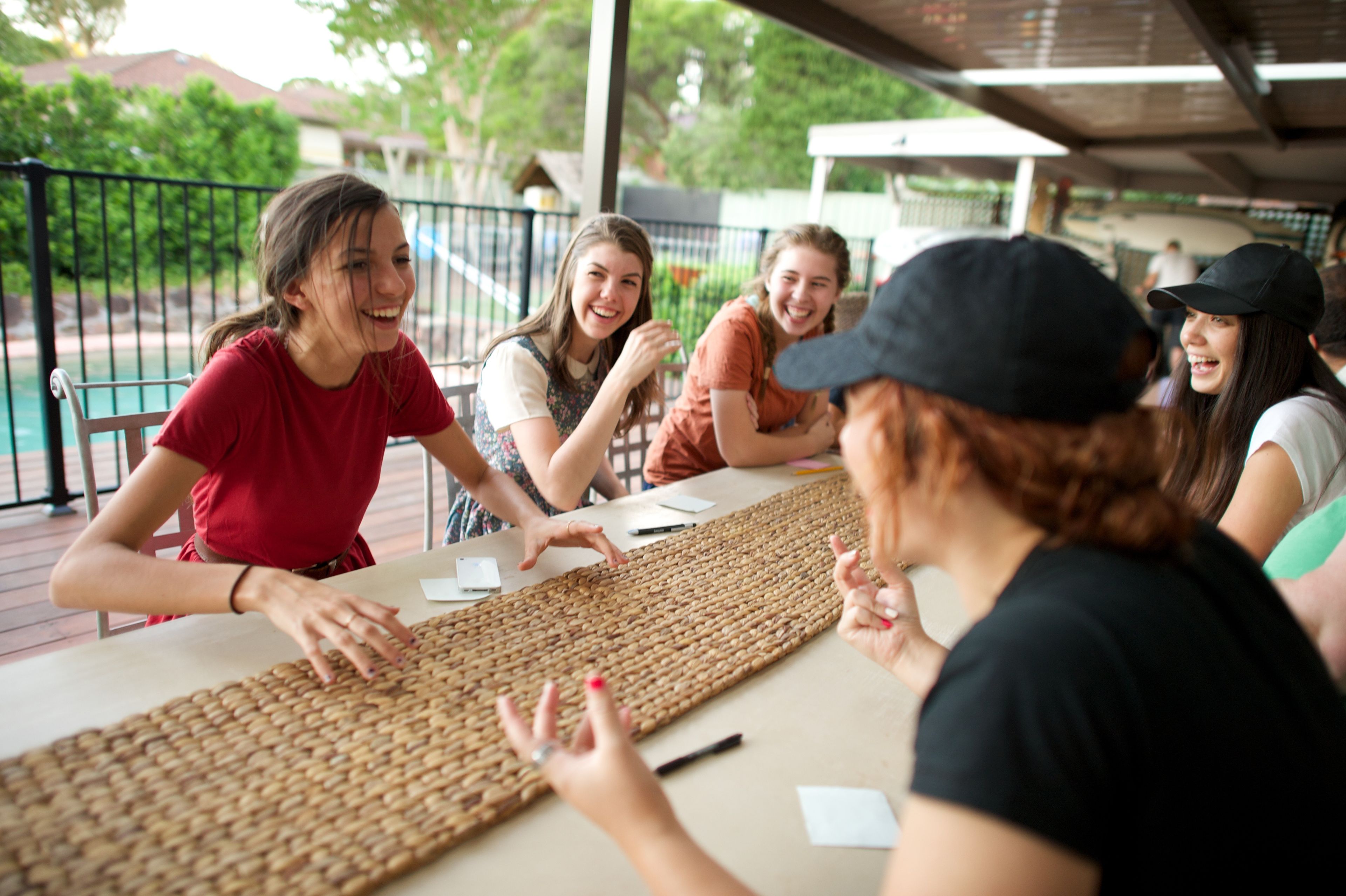 A group of young women playing games outside together.