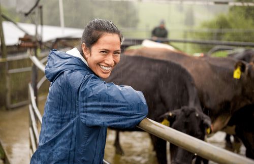 young woman smiling in rain